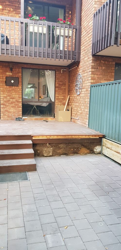 Pavers laid - posts and retaining wall