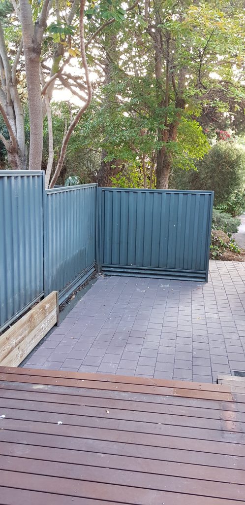 Pavers laid - posts and retaining wall