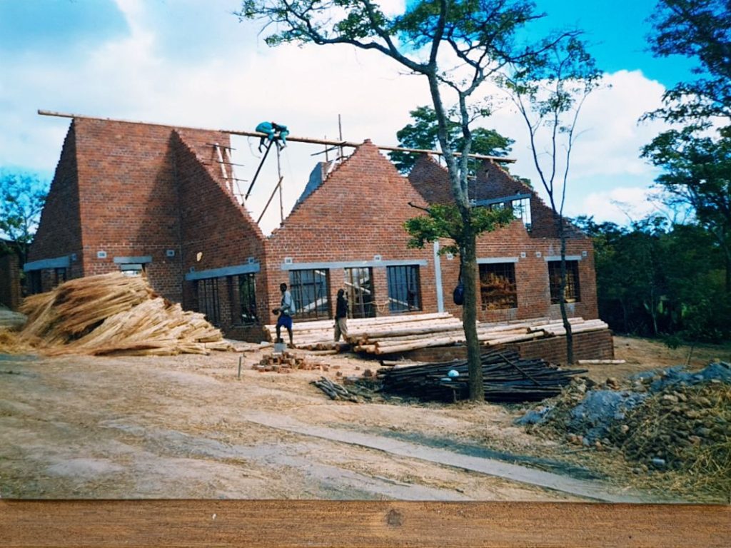 First roof truss goes up on thatched-house build