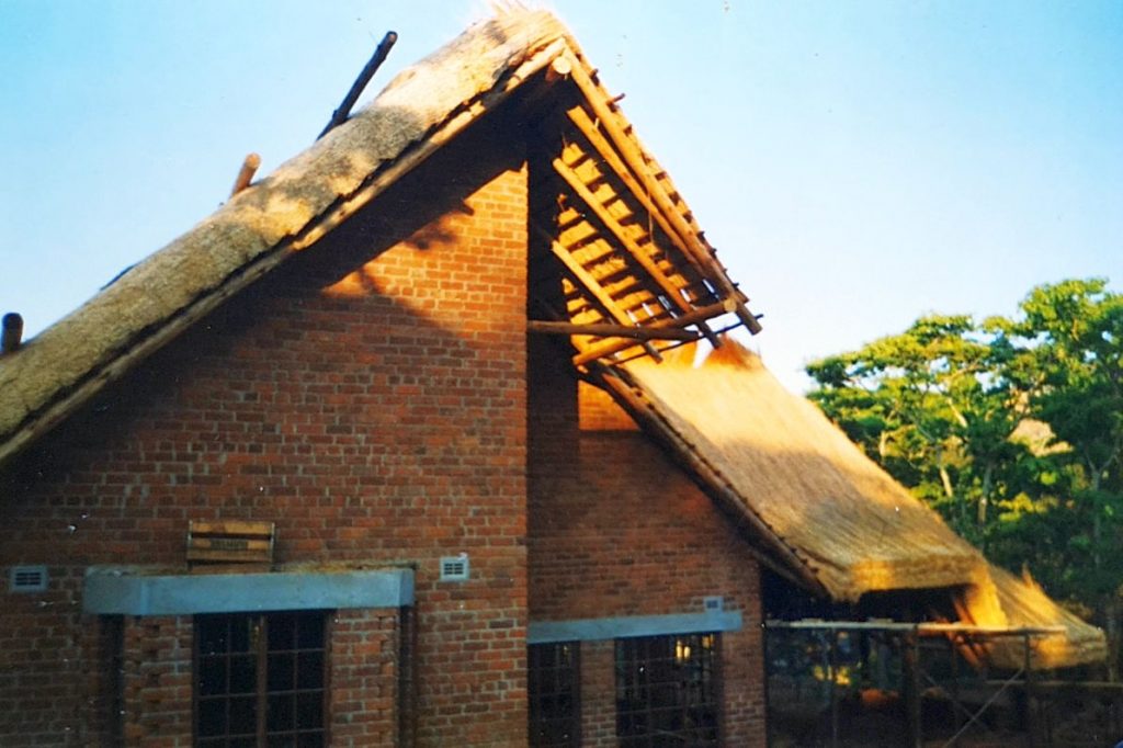 Start of thatching on thatched-house build