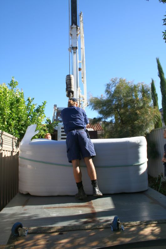 Crane to lift the spa over the roof