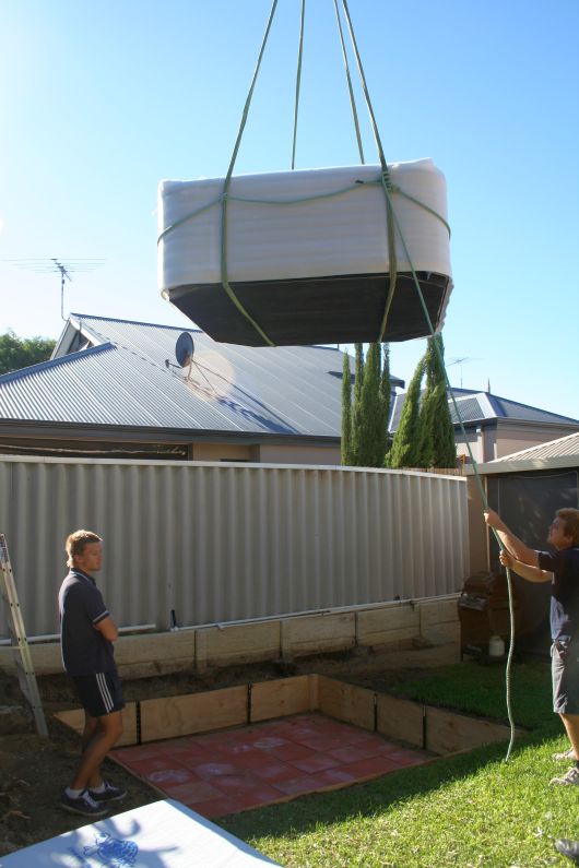 Crane to lift the spa over the roof