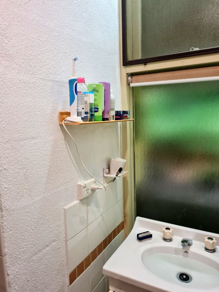 Removing all the old plastic rails and shelves