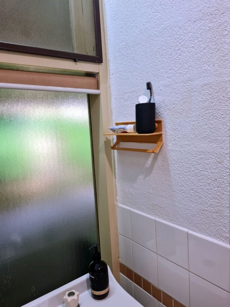Removing all the old plastic rails and shelves
