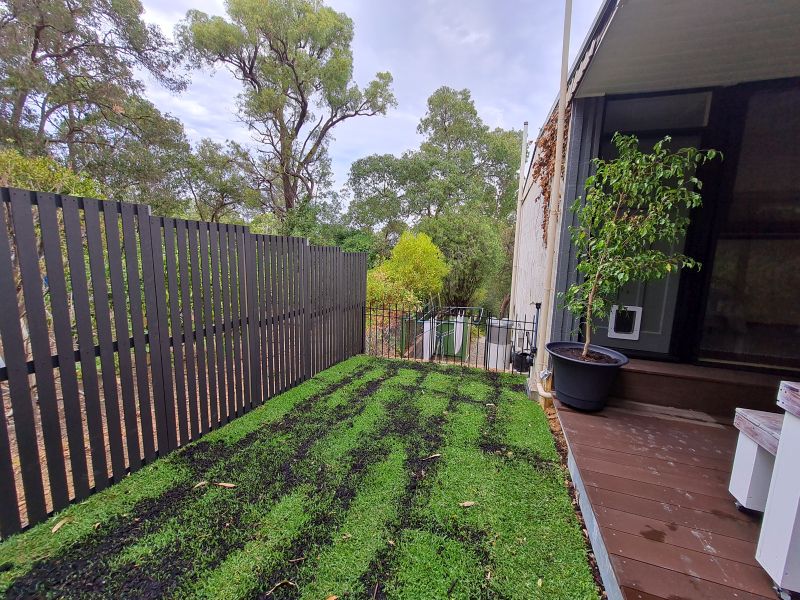 Grey garden screen finished and lawn laid.